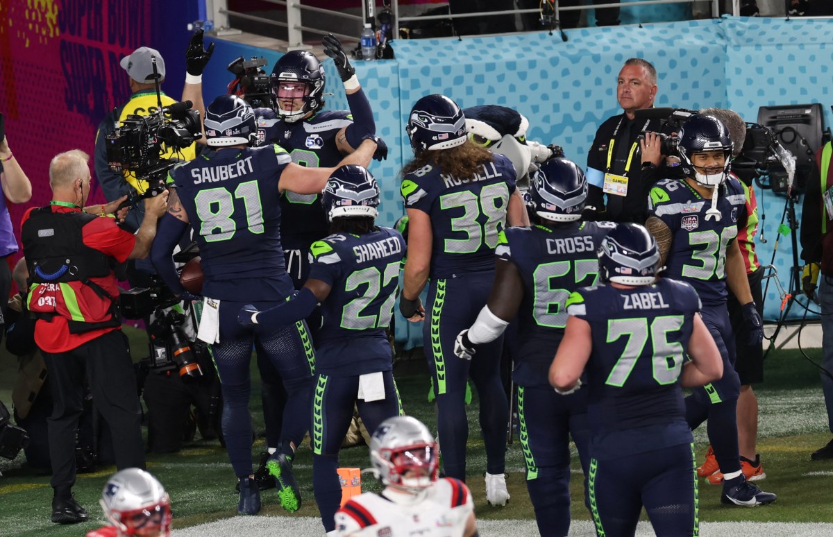 Seattle Seahawks' tight end #88 AJ Barner celebrates with teammates after scoring a touchdown during Super Bowl LX between the New England Patriots and the Seattle Seahawks at Levi's Stadium in Santa Clara, California on February 8, 2026. (Photo by Patrick T. Fallon / AFP via Getty Images)
