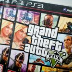Close view of the packaging of the console game Grand Theft Auto 5.