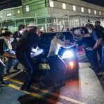 Protesters try to block a vehicle from leaving Delaney Hall, which is being used as an Immigration and Customs Enforcement (ICE) detention center, in Newark, New Jersey, on June 5, 2026.