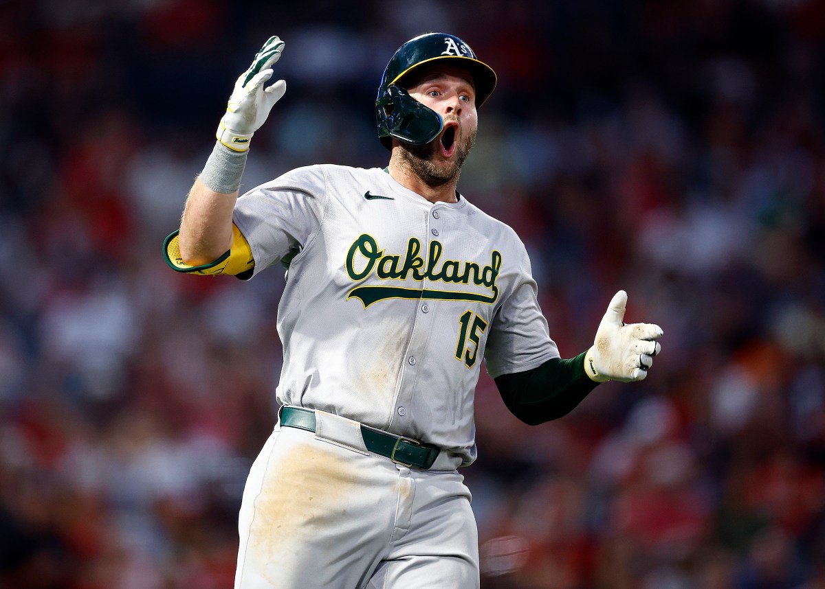 ANAHEIM, CALIFORNIA - JULY 26:  Seth Brown #15 of the Oakland Athletics reacts on a foul call against the Los Angeles Angels in the sixth inning at Angel Stadium of Anaheim on July 26, 2024 in Anaheim, California.  The call was overturned and Brown hit a RBI single.  (Photo by Ronald Martinez/Getty Images)