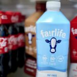Fairlife ultra-filtered fat free, whole, and chocolate milk and Coca-Cola bottles arranged in Germantown, New York, US, on Tuesday, Dec. 3, 2024. Fairlife, which uses a specialized filtering process to boost protein and cut sugar and lactose in its milk products, helped spark the modern protein craze that's unfolded alongside the rise of Ozempic and other GLP-1 drugs. Photographer: Gabby Jones/Bloomberg via Getty Images