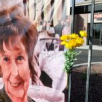 A photograph of Nancy Guthrie is displayed on a banner in front of the KVOA television station on March 01, 2026 in Tucson, Arizona.