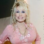 Dolly Parton (Crédito: Jason Kempin/Getty Images for American Greetings) e Taylor Swift (Crédito: Kevin Mazur/Getty Images for TAS Rights Management)