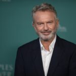 Sam Neill arrives at the premiere of