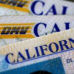 SAN ANSELMO, CA - MAY 09: In this photo illustration, the California Department of Motor Vehicles (DMV) logo appears on a California driver license on May 9, 2017 in San Anselmo, California. The California Department of Motor Vehicles is being accused in a federal lawsuit of violating voter federal "motor voter" law with a requirement for over 1 million residents who renew their license by mail to fill out a seperate form with their renewal. (Photo Illustration by Justin Sullivan/Getty Images)