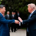 U.S. President Donald Trump (R) shakes hands with Chinese President Xi Jinping in Beijing on May 15, 2026.